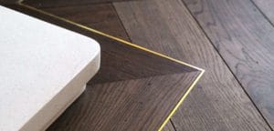 17.Lyon herringbone flooring with border and brass inlay